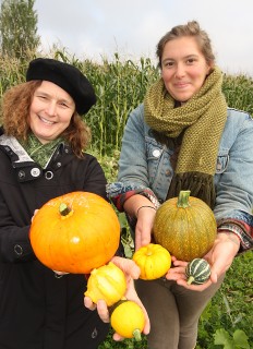 PCC sustainability staff Elaine Cole (left) and Nora Lindsey show off some of the Rock Creek Campus' pumpkins and vegetables. They estimate PCC will have nearly 500 pounds worth for the Harvest Festival.
