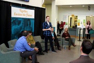 Southeast Center student leader Patrick Stupfel chats with the standing room only crowd in the Great Hall.