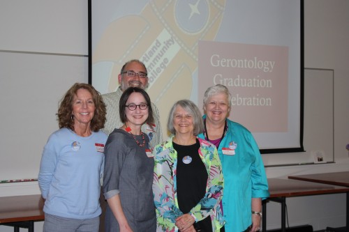 Gerontology Program community partners pose with Director Jan Abushakrah (second from right) at the 2014 completion ceremony.