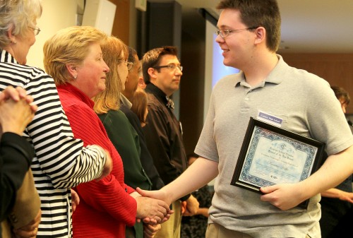 Vice President of Academic Services Chris Chairsell congratulates Century High School student Kamran Hetke, who earned credit in computer technology through PCC.