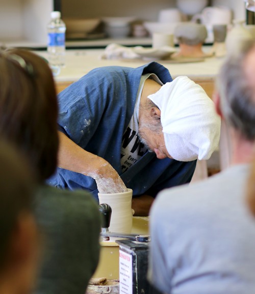 Shuichi Ogata demonstrates techniques in the Rock Creek ceramics studio.