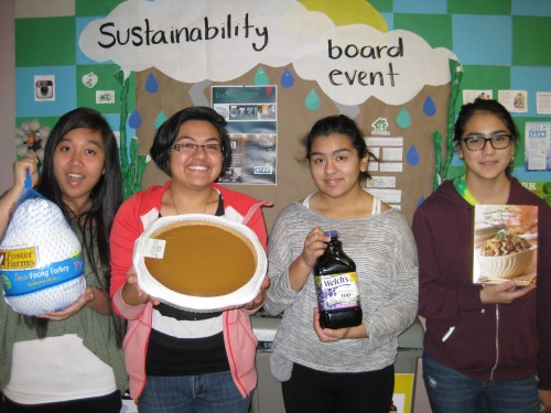 Packing the Thanksgiving boxes were (left) Tiki Hoang, ASPCC program director; Maricruz Gonzalez Vazquez, WRC advocate; Bianca and Natalia Bermejo, volunteers from Forest Grove High School.