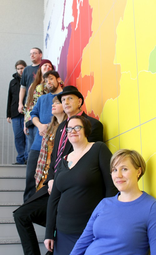 The Writing Program, thanks to the recent expansion of the campus, has a lot more classroom and study space to utilize as it expands the number of classes offered. Here, students in the program along with Jessica Johnson (far right) and Blake Hausman (fourth from left) hang out in the new Library.