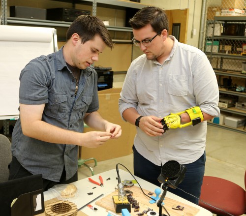 Eric Thomas, left, works with fellow student Jordan Nickerson in Sylvania's MakerSpace.
