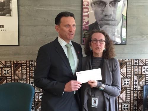 Union Bank Vice President Shawn DuBurg presents Portland Teachers Program Director Deborah Cochrane with a check for $7,500 in the PTP offices at Cascade.