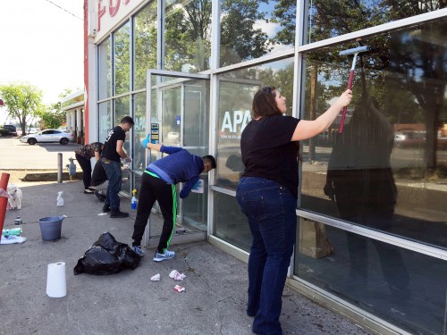 ASPCC student leaders chip in to help remove graffiti on building across the street. 