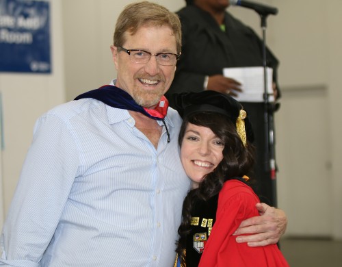 At PCC's commencement ceremony in June, Dean of Sylvania's English and World Languages Division Dave Stout congratulates Frances Fagan for her acceptance into Yale.