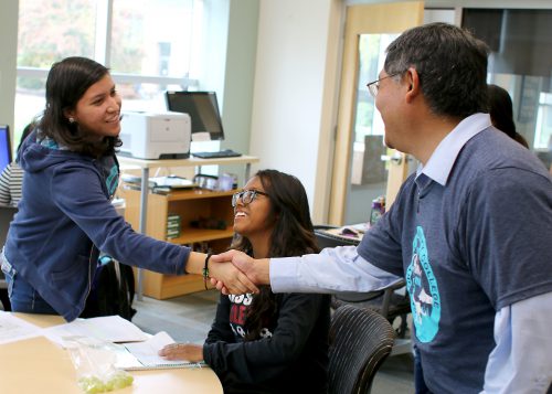 Mitsui greets students at Rock Creek's Multicultural Center.