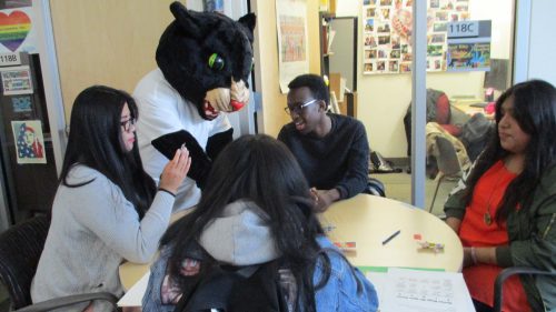 Poppie the Panther advises students as they play a game at the open house hosted by PCC Rock Creek's multicultural and women's resource centers. 