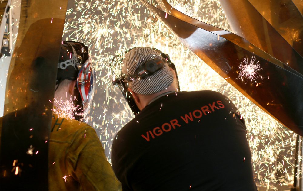 Student Doug French (left) gets a lesson from an instructor at the Swan Island welding lab.