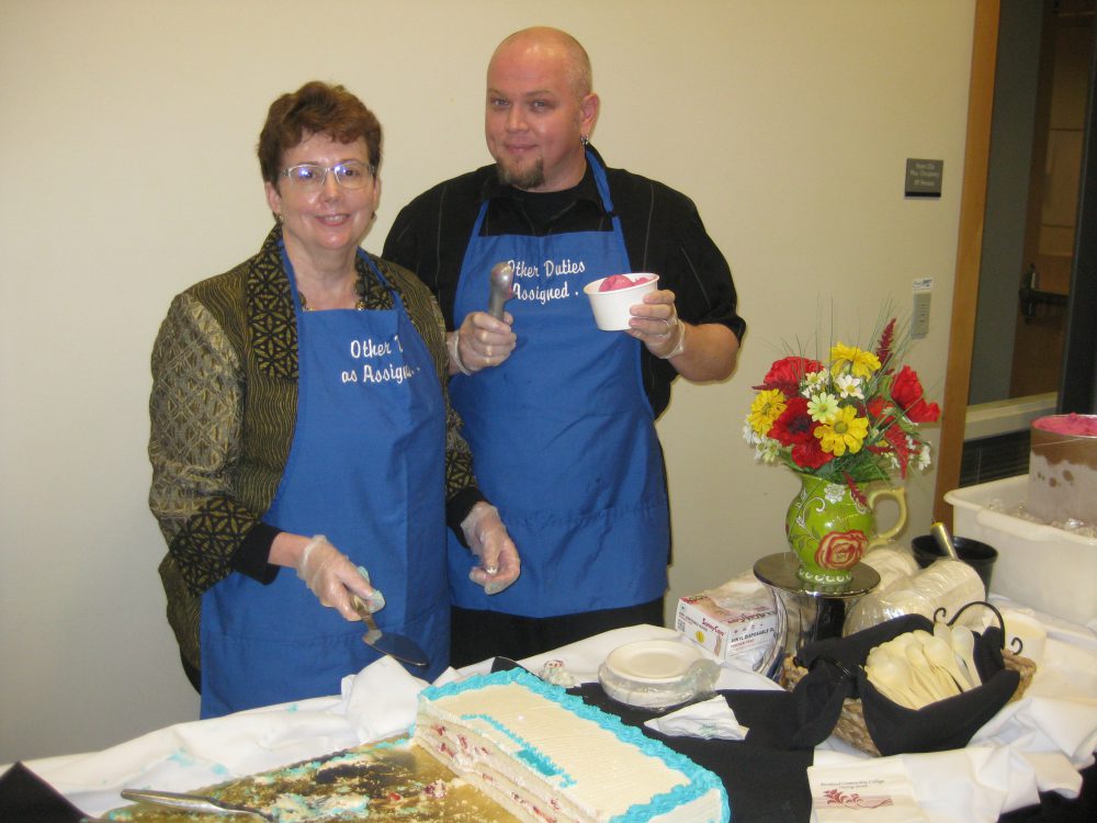 Cheryl Scott, dean of Instruction at Rock Creek, serves up some birthday cake with staff.