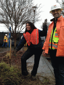 Hoffman crew members help community members dig out and bundle up free plants and trees.