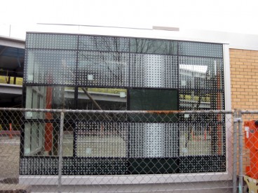 The construction crew built this mock up structure to provide information about the physical separation between the interior and exterior environments of the actual buiding and test the glass material for the front of the building.