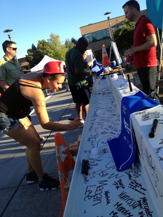 People had the opportunity to memorialize their participation at the National Night Out event by signing a construction beam to be erected in the new academic building at Cascade Campus.