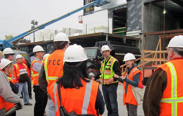 Jacob McKay, Site Superintendent with Hoffman Construction gives the group a general outline of the site.