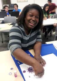 Kimberly Dessou works on circuitry during the Young Makers Club at the Southeast Campus.