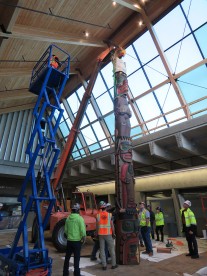 In addition to being protected from elements, the Welcoming Pole's new home in the busy east entry atrium will allow it to be enjoyed by more people.