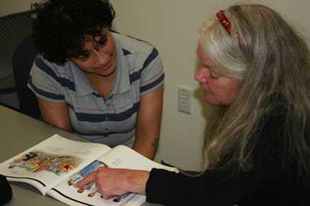 Two women reading together