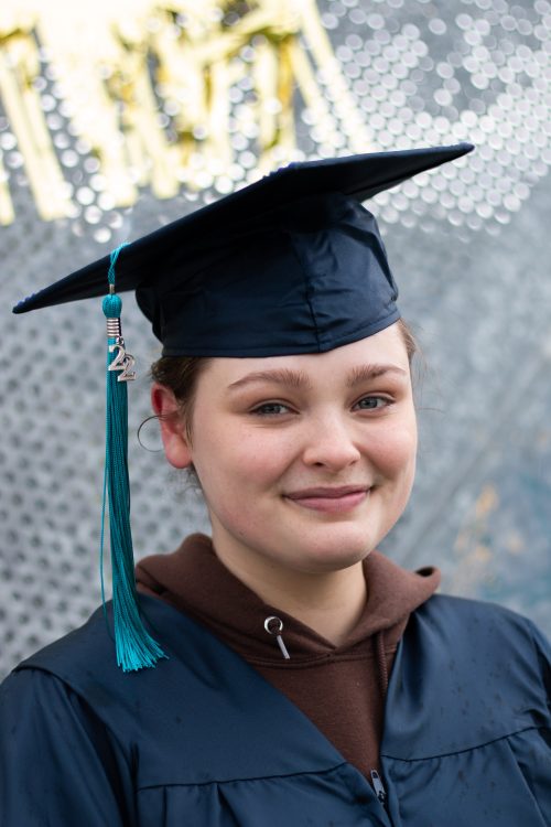 Student smiling in graduation cap